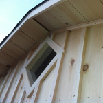 A close up of the window on a shed