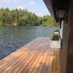 A dock with a planter on the side of it.