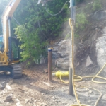 A yellow hose is connected to the pipe.